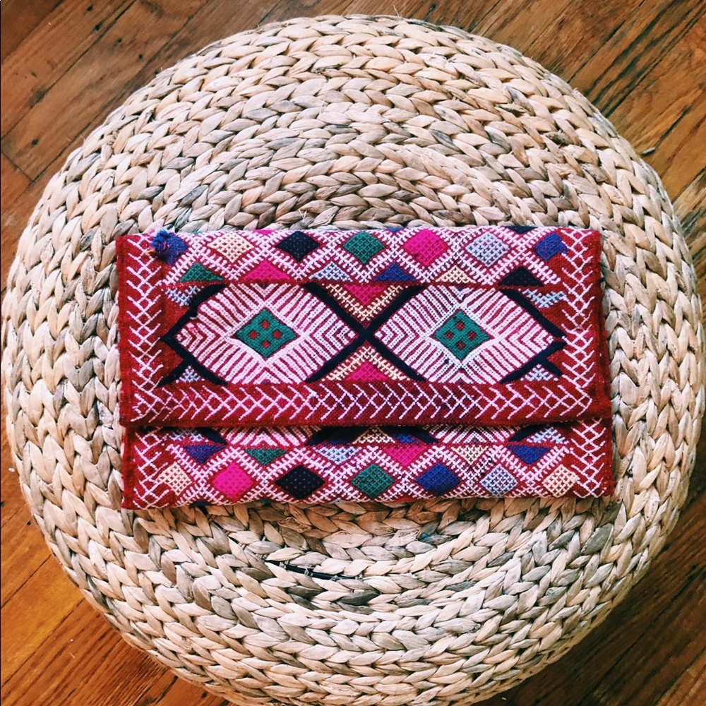 Beautifully hand-stitched, boho foldable clutch.